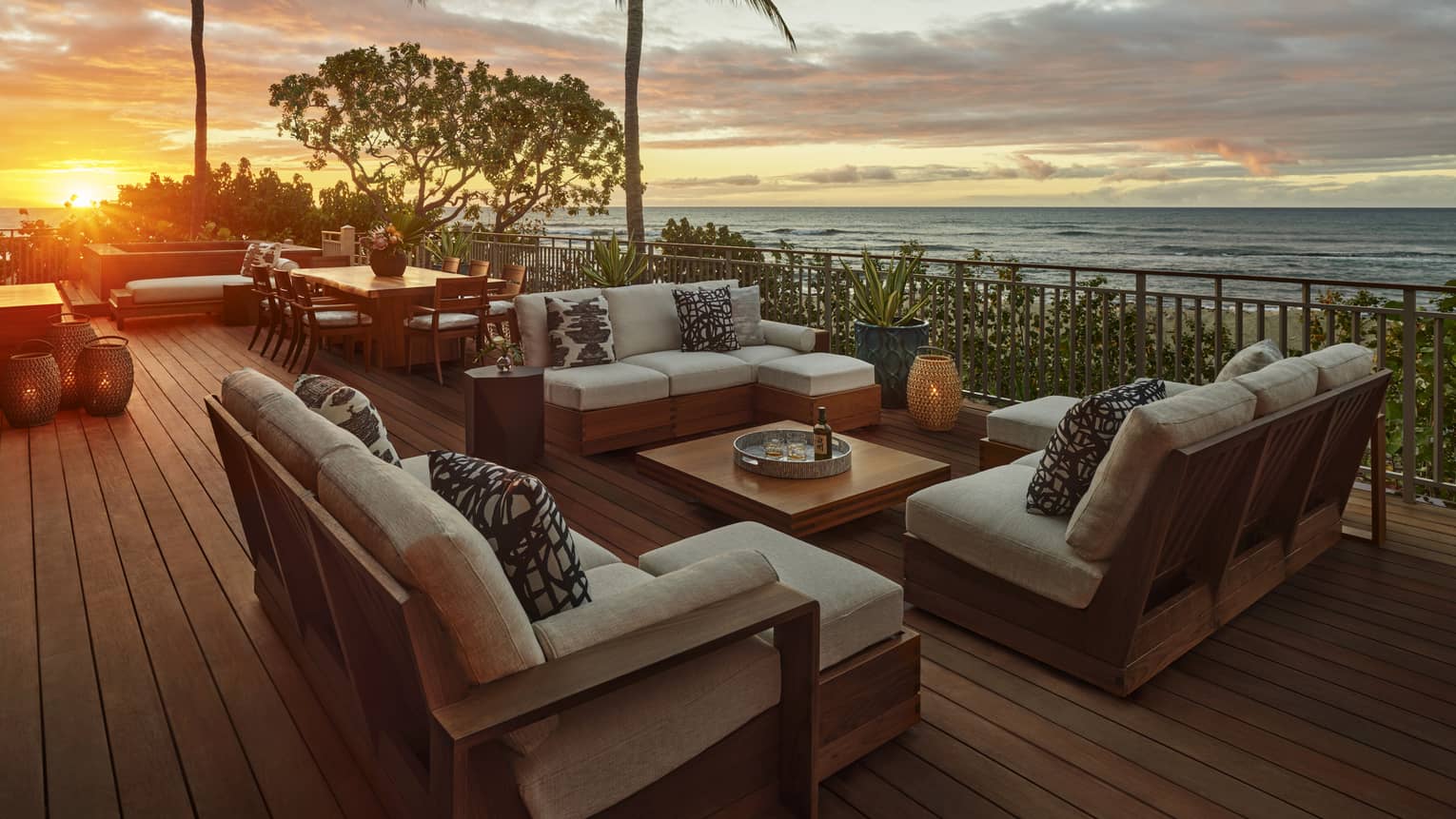 Outdoor deck with lounge furniture at sunset with ocean view