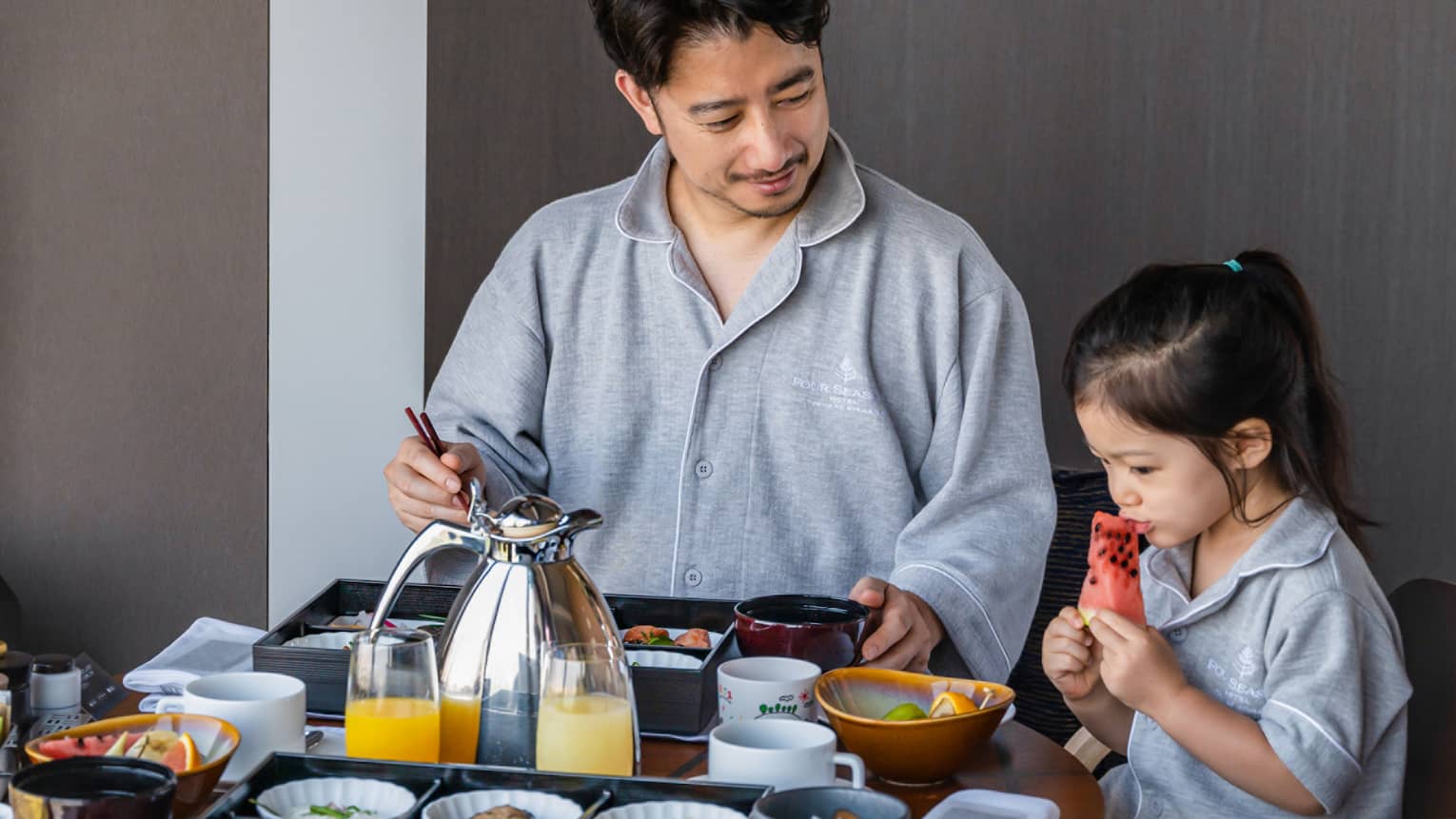 Man and his daughter enjoy In-Room Dining breakfast