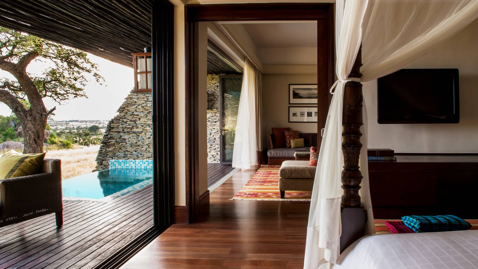 Terrace Suite Waterhole View poster bed, canopy by open wall to plunge pool