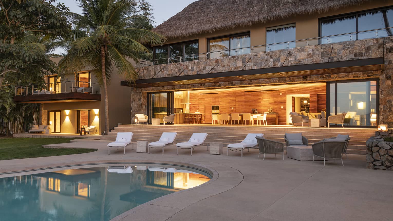 Private residence, Casa Vista, at Four Seasons Resort Tamarindo, illuminated pool deck at night