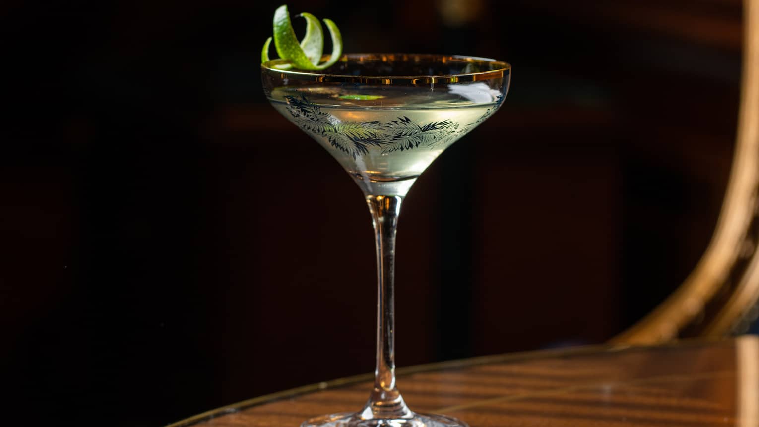 A cocktail in a stem glass.
