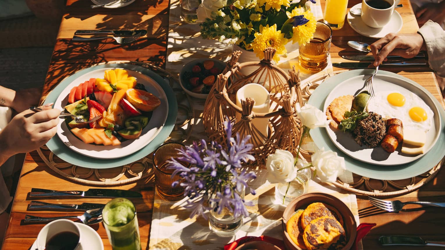 Outdoor table filled with food and florals