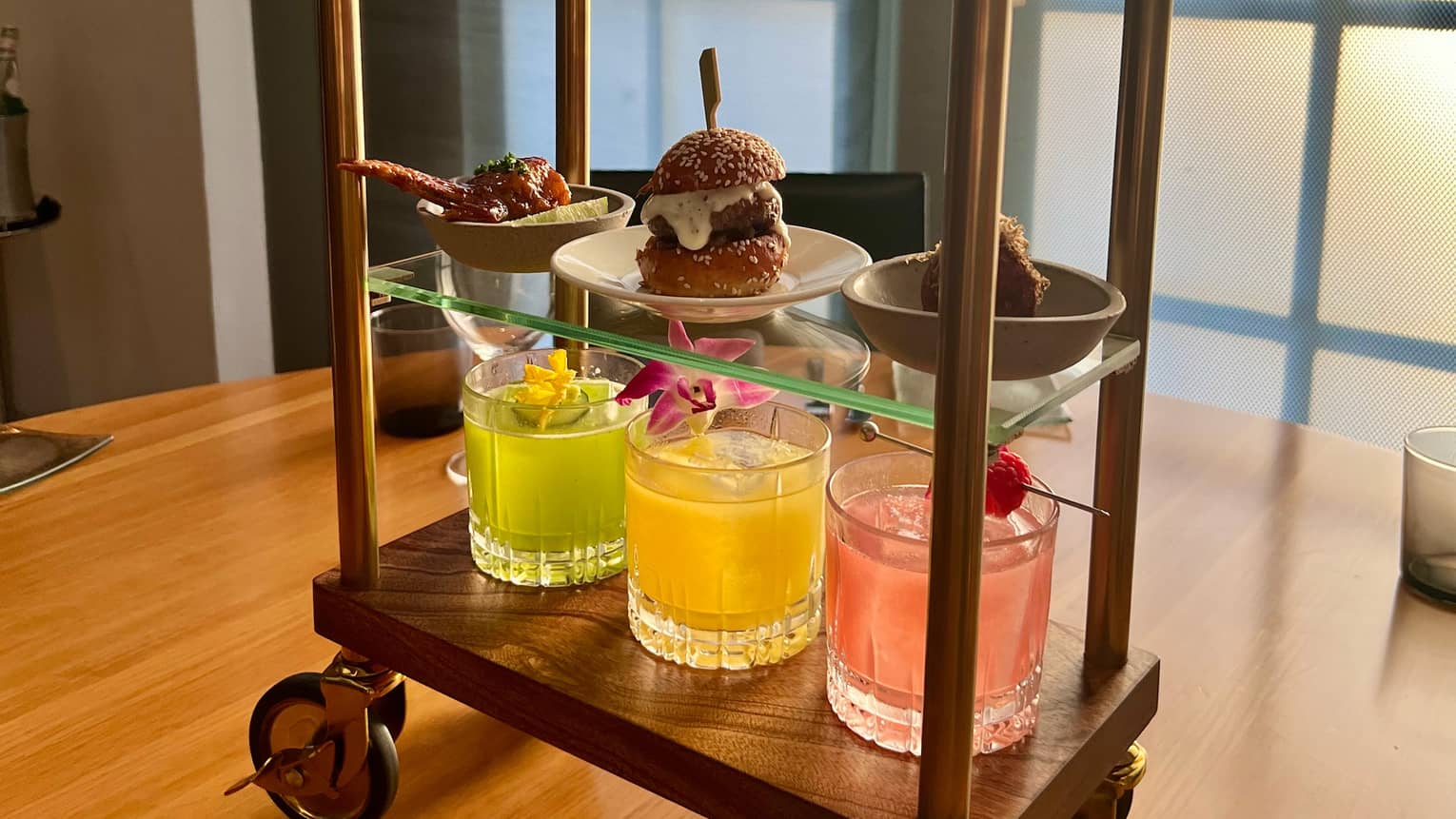 Food served on a miniature bell cart?shaped display