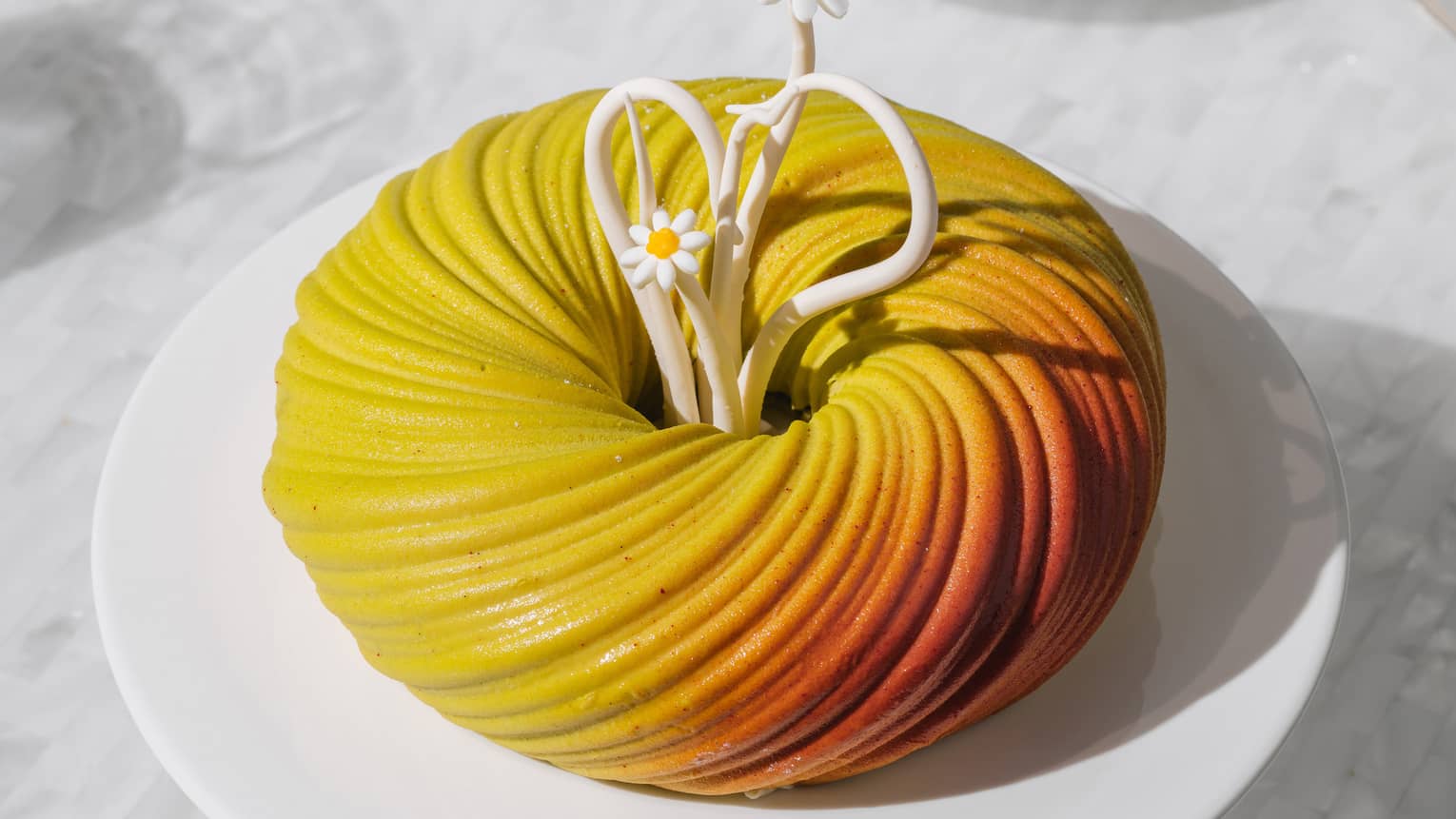 Pistachio cherry tart with edible daisy garnishes