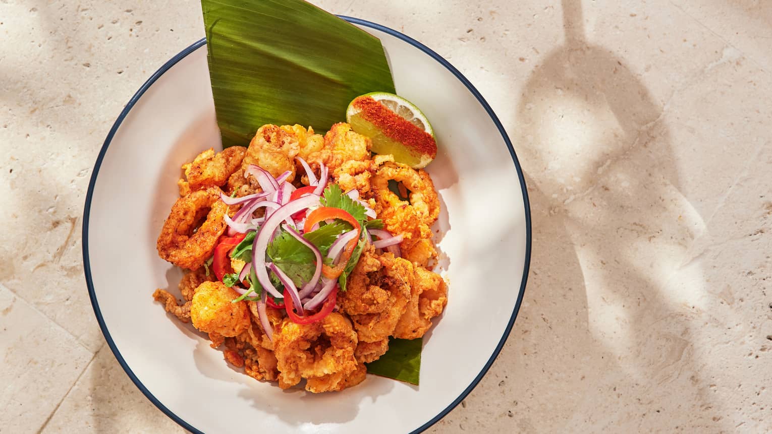 Crispy seafood dish and grapefruit drink