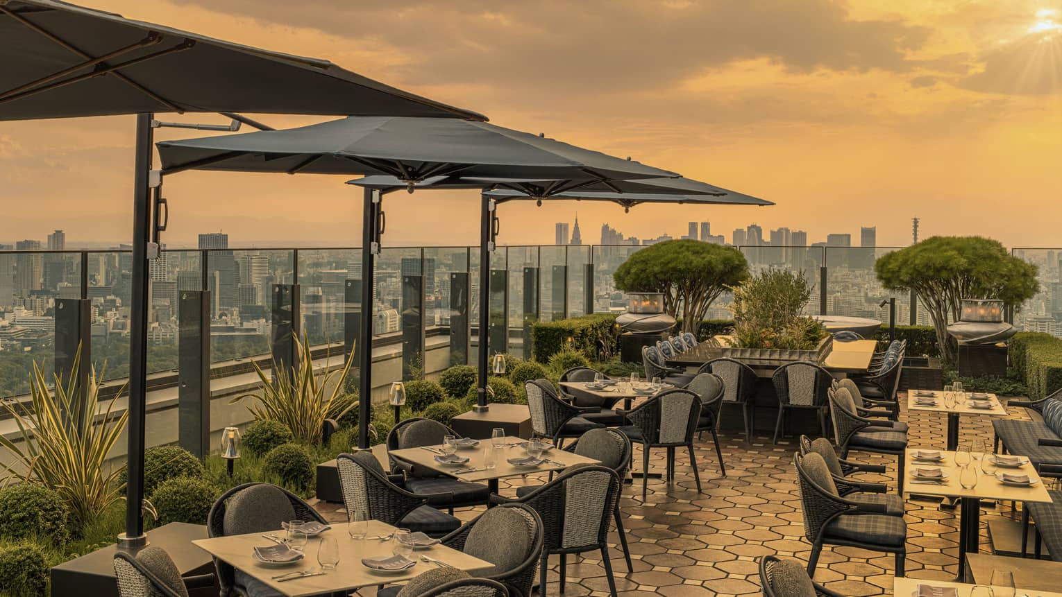 Hotel restaurant terrace with city view at sunset
