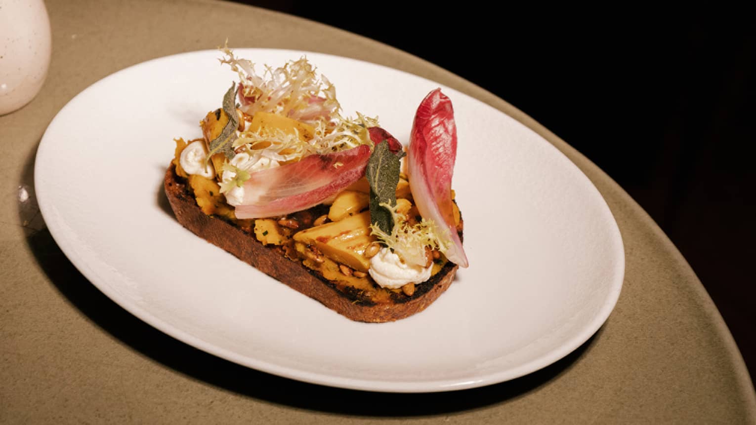 Roasted squash tartine with delicata and butternut squash, whipped ricotta, candied pumpkin seeds and black truffle honey
