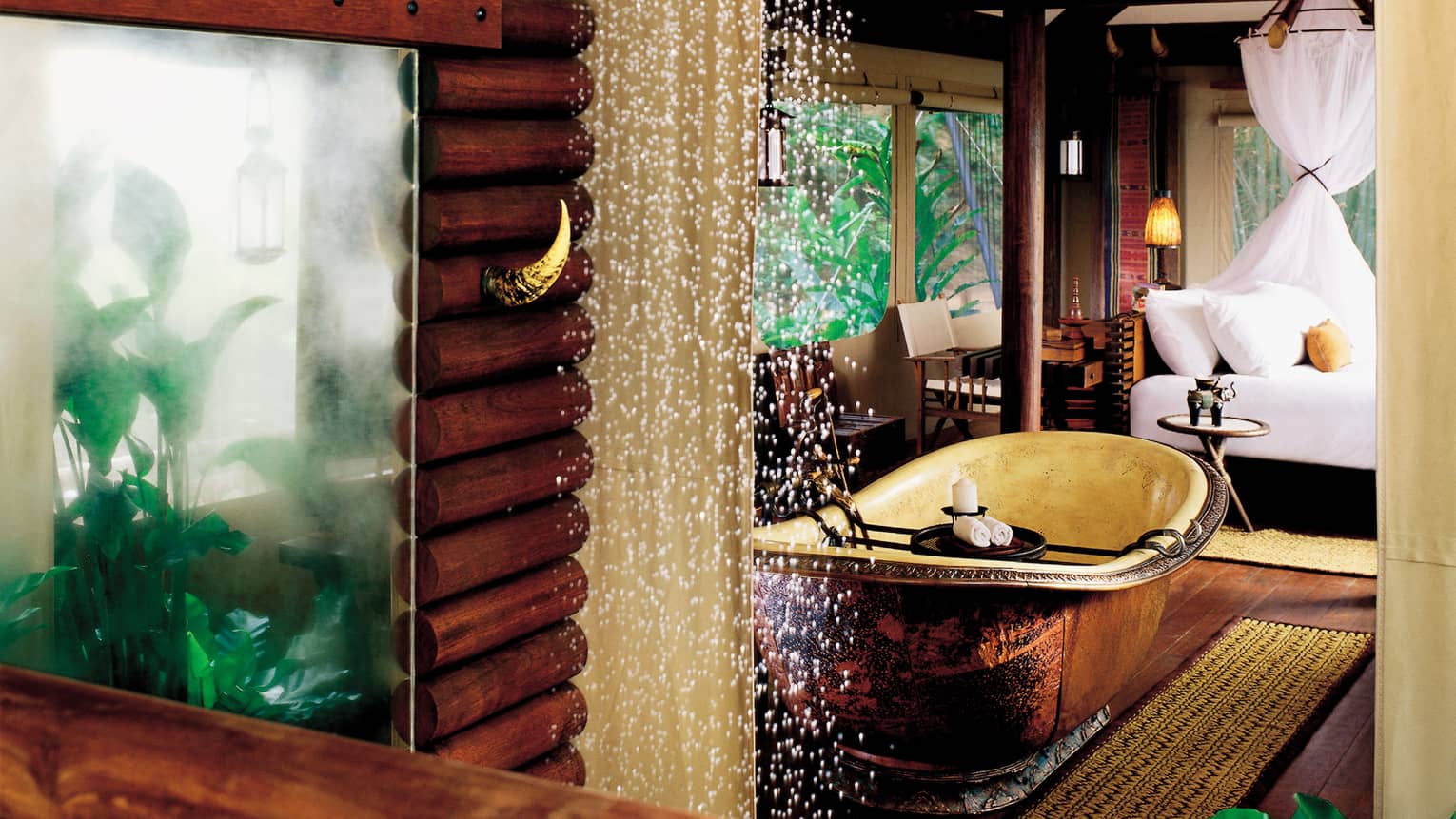 Rain shower in wood spa room near tub, tropical plants