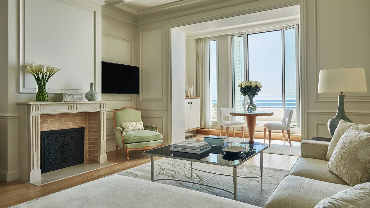Palace Sea-View Suite, sofa, armchair under high ceilings, fireplace, window alcove with dining table