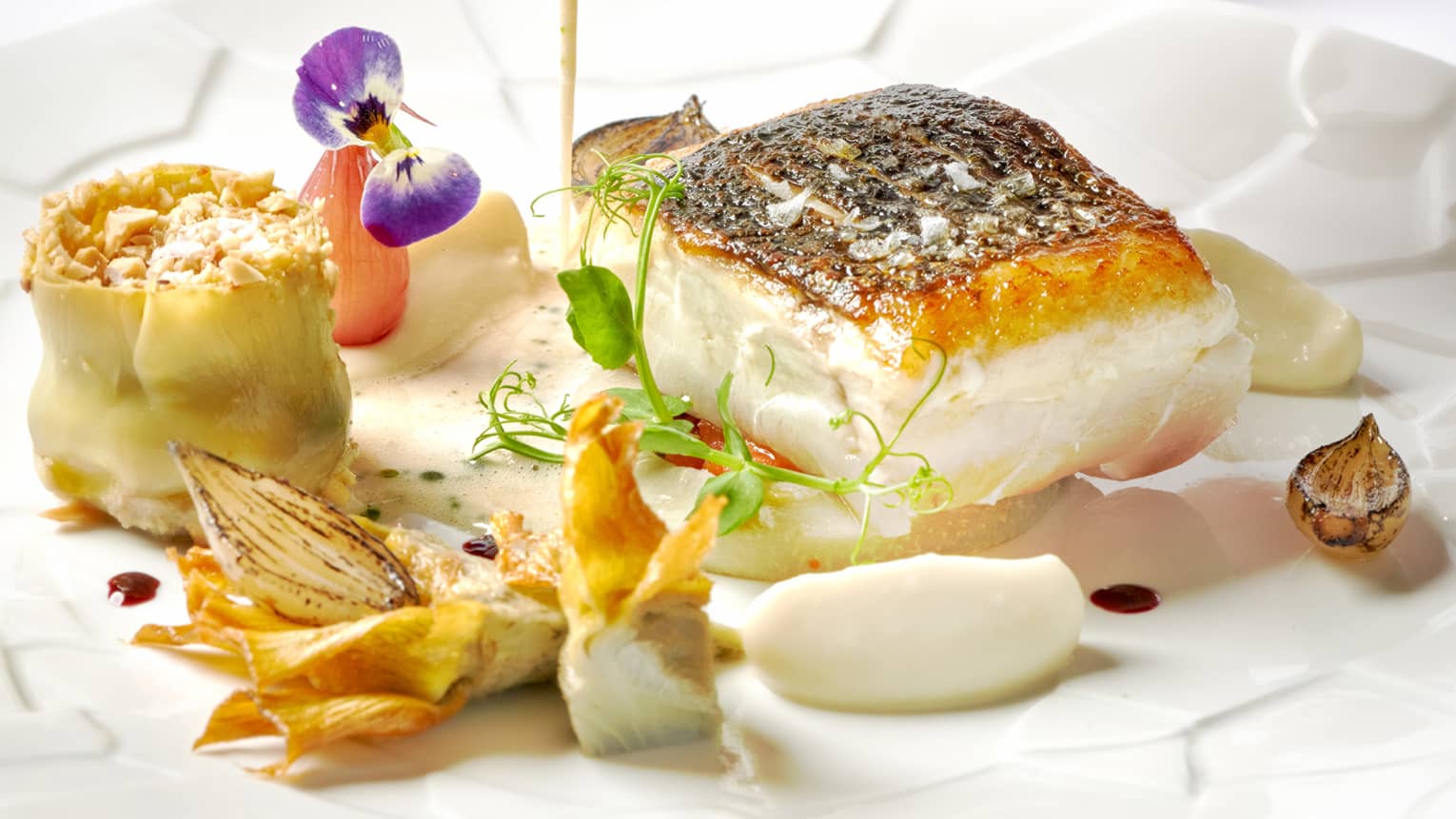 Wild sea bass, violets artichokes and Vesuvio Falanghina sauce