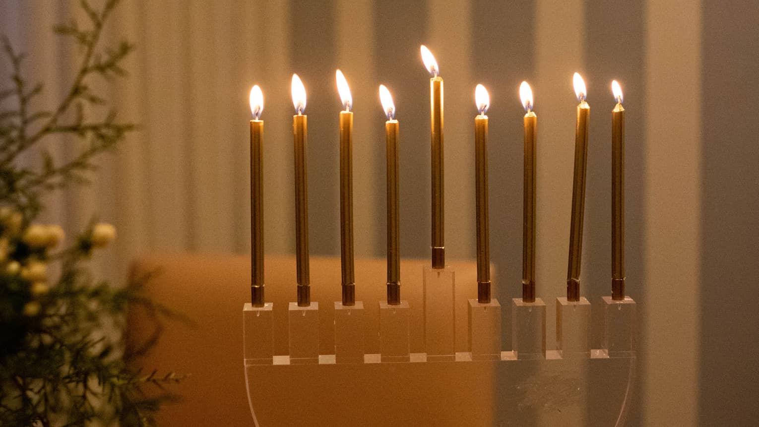 A menorah on a wood table.