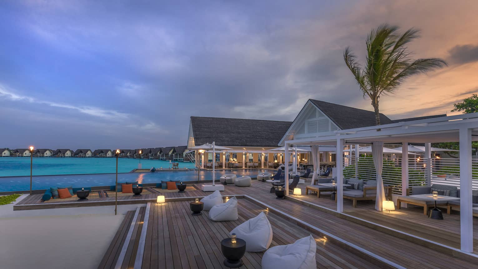 Beanbag chairs arranged outside the Blu Beach Club int he Maldives