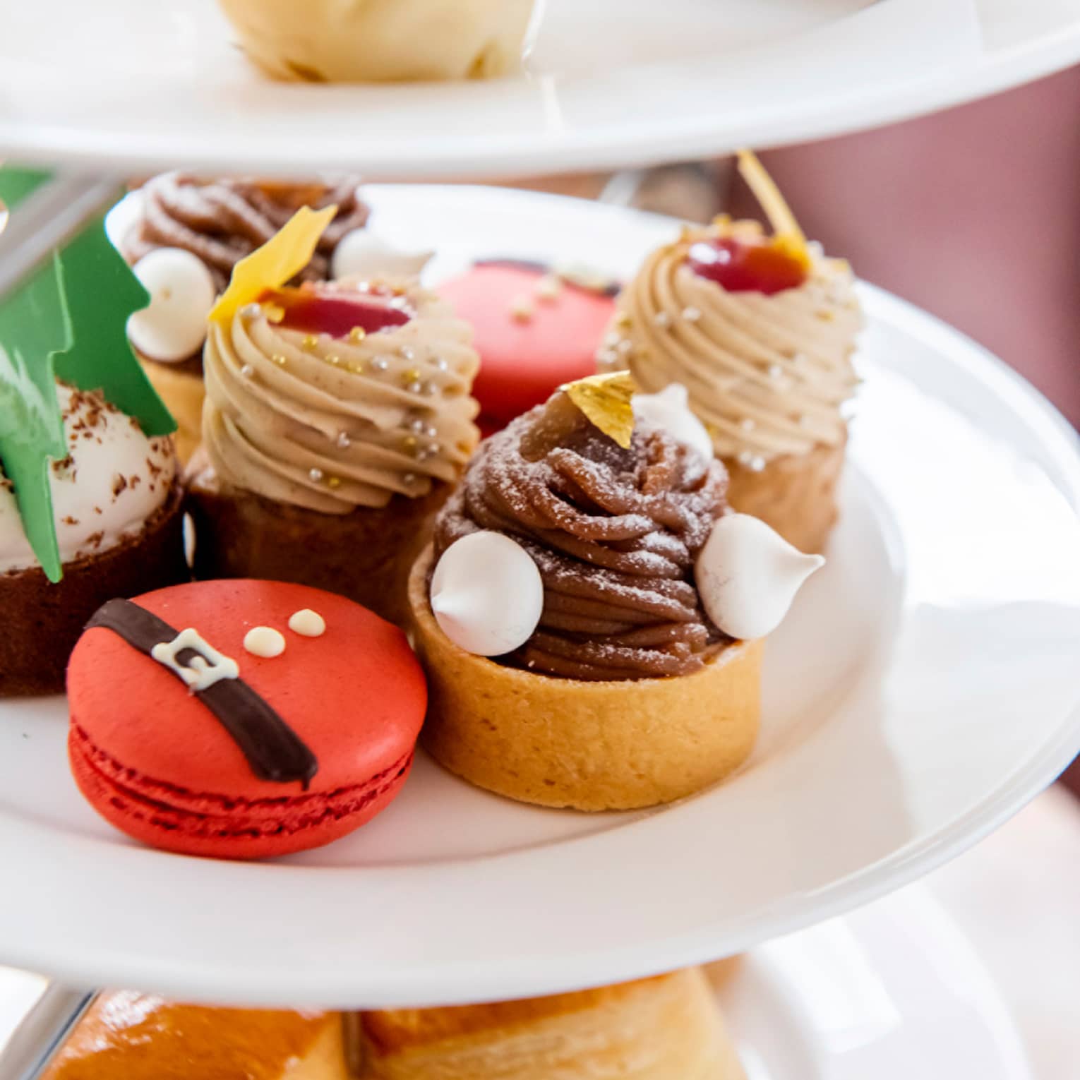 An assortment of holiday-themed desserts on a white plate