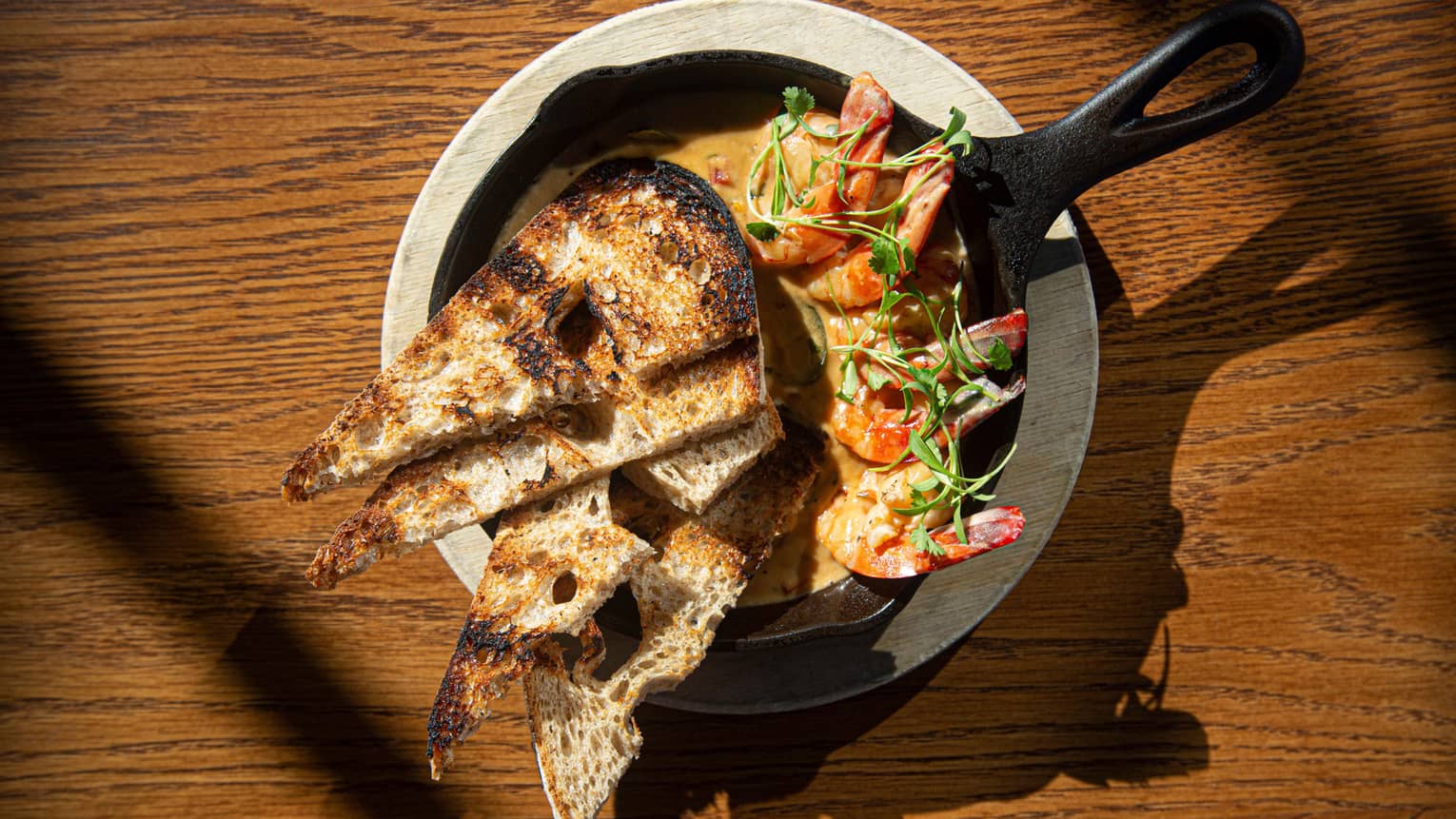 spicy shrimp with coconut broth, chili, grilled country toast on