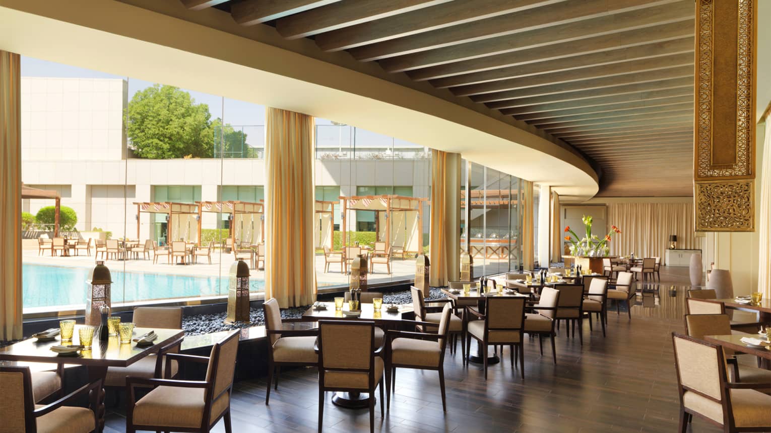 An open dining area overlooking a pool
