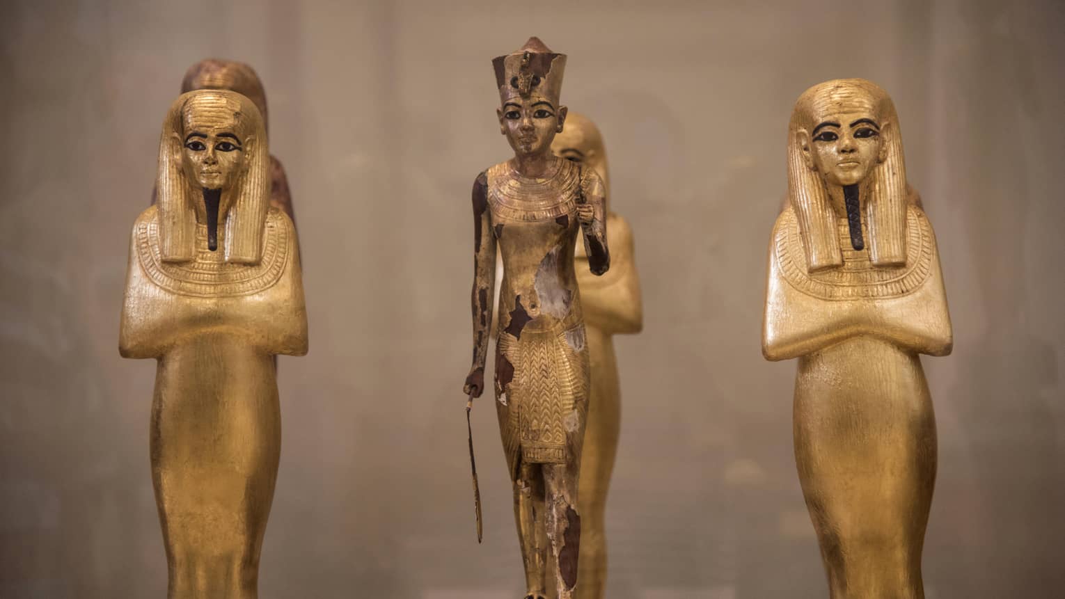 Three Egyptian statues in museum