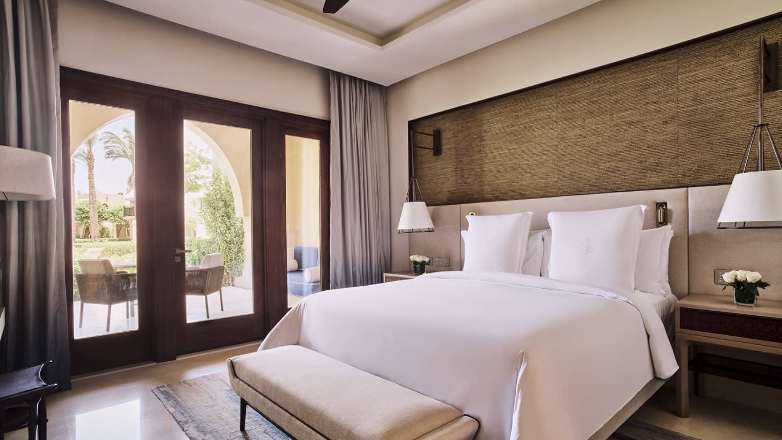 Luxury bedroom with king bed and walk-out terrace