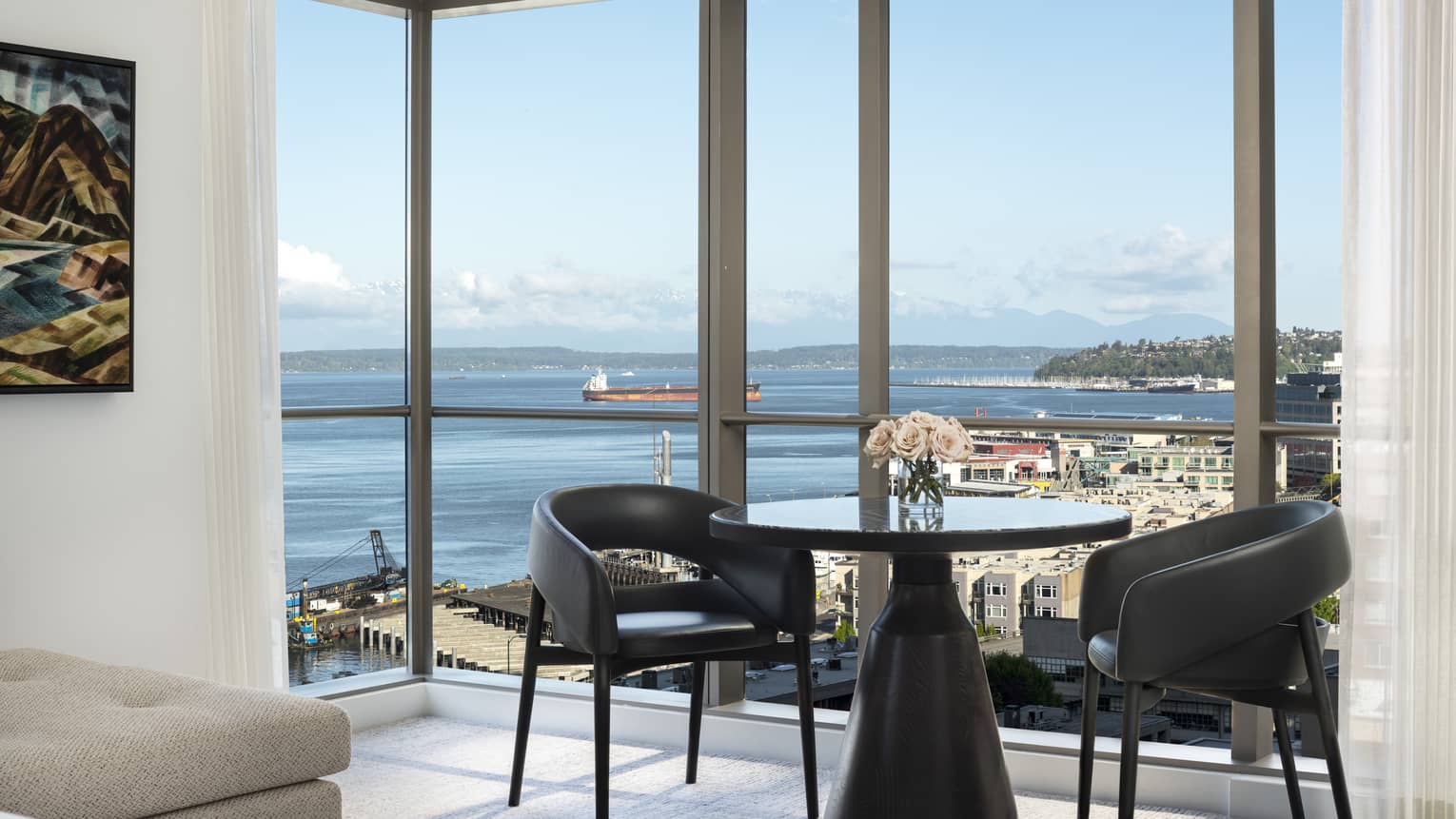A table in the corner of the Prime Bay View Room overlooks the water and colorful buildings below