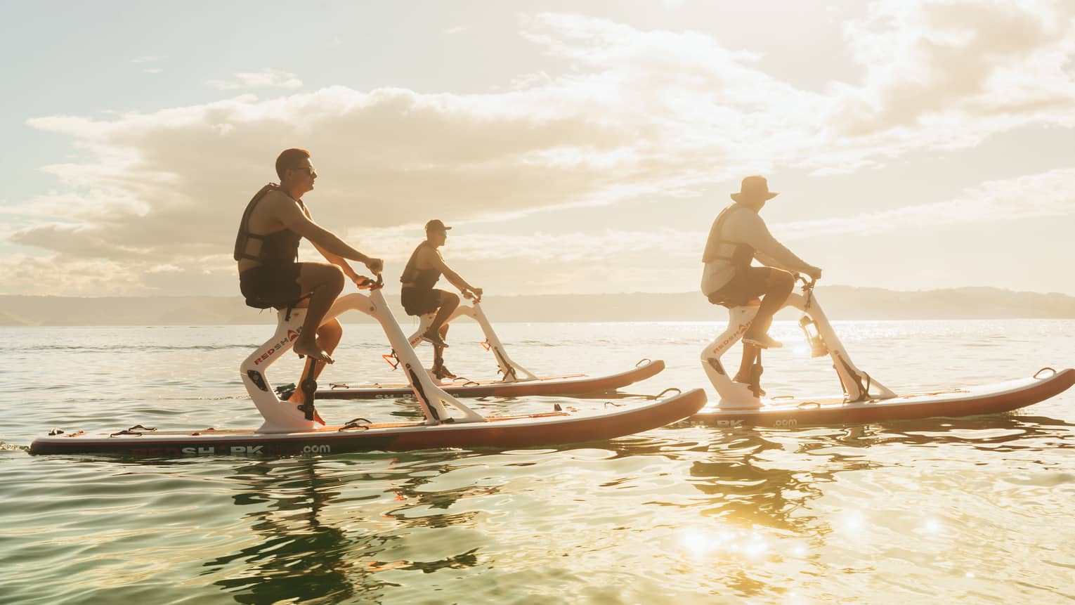 Three people riding waterbikes