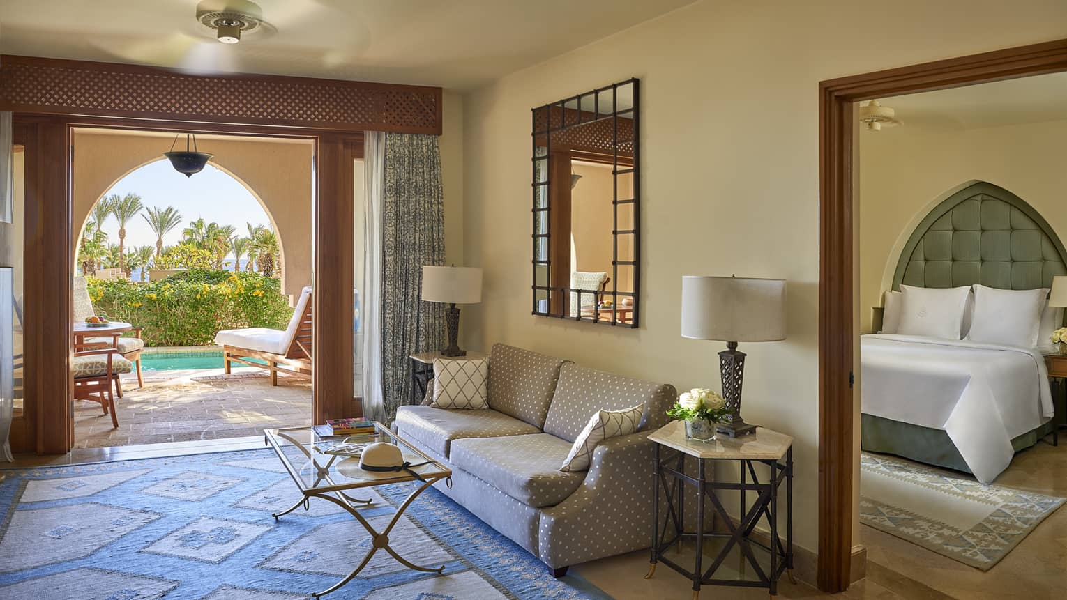 Living area, connected to bedroom, with walk-out entrance to pool area