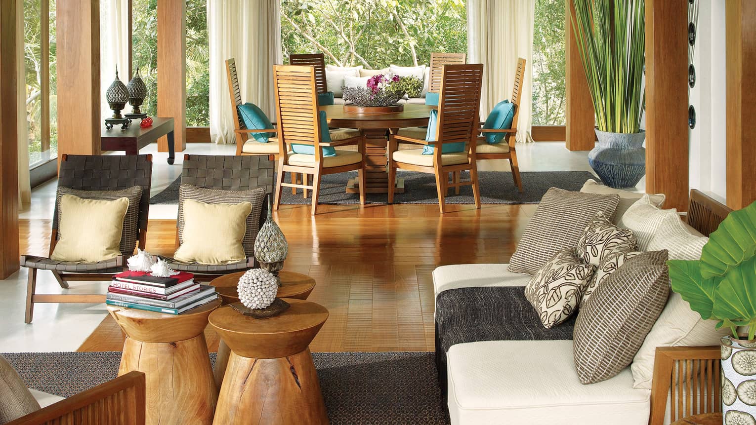 Four-Bedroom Residence Villa with Pool living room with sofa, wood chairs and tables, colourful pillows