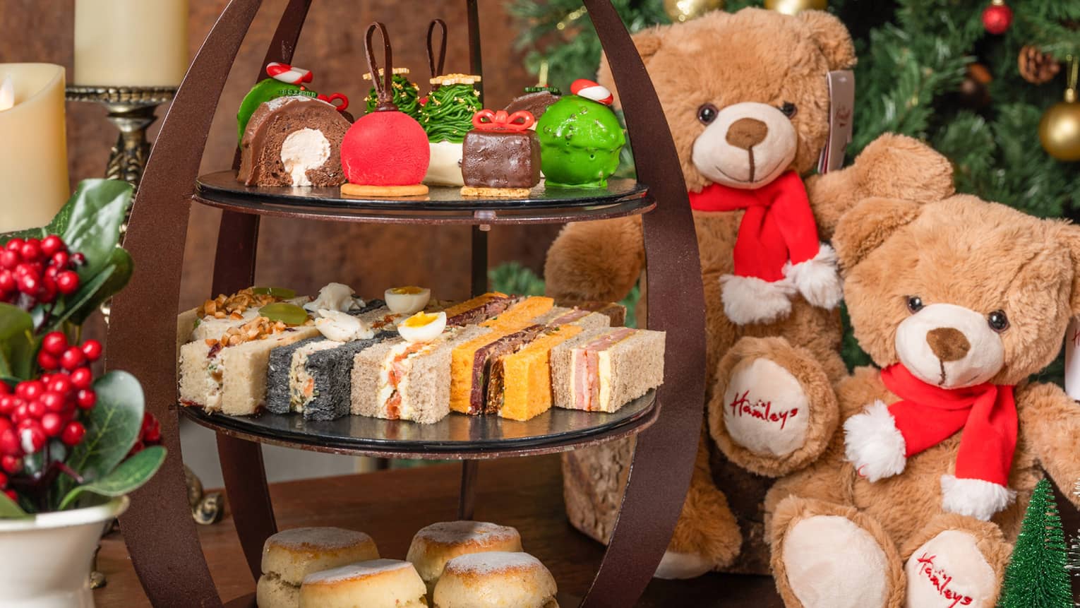 Christmas afternoon tea display with sweets and savouries, Christmas tree and teddy bear adornments