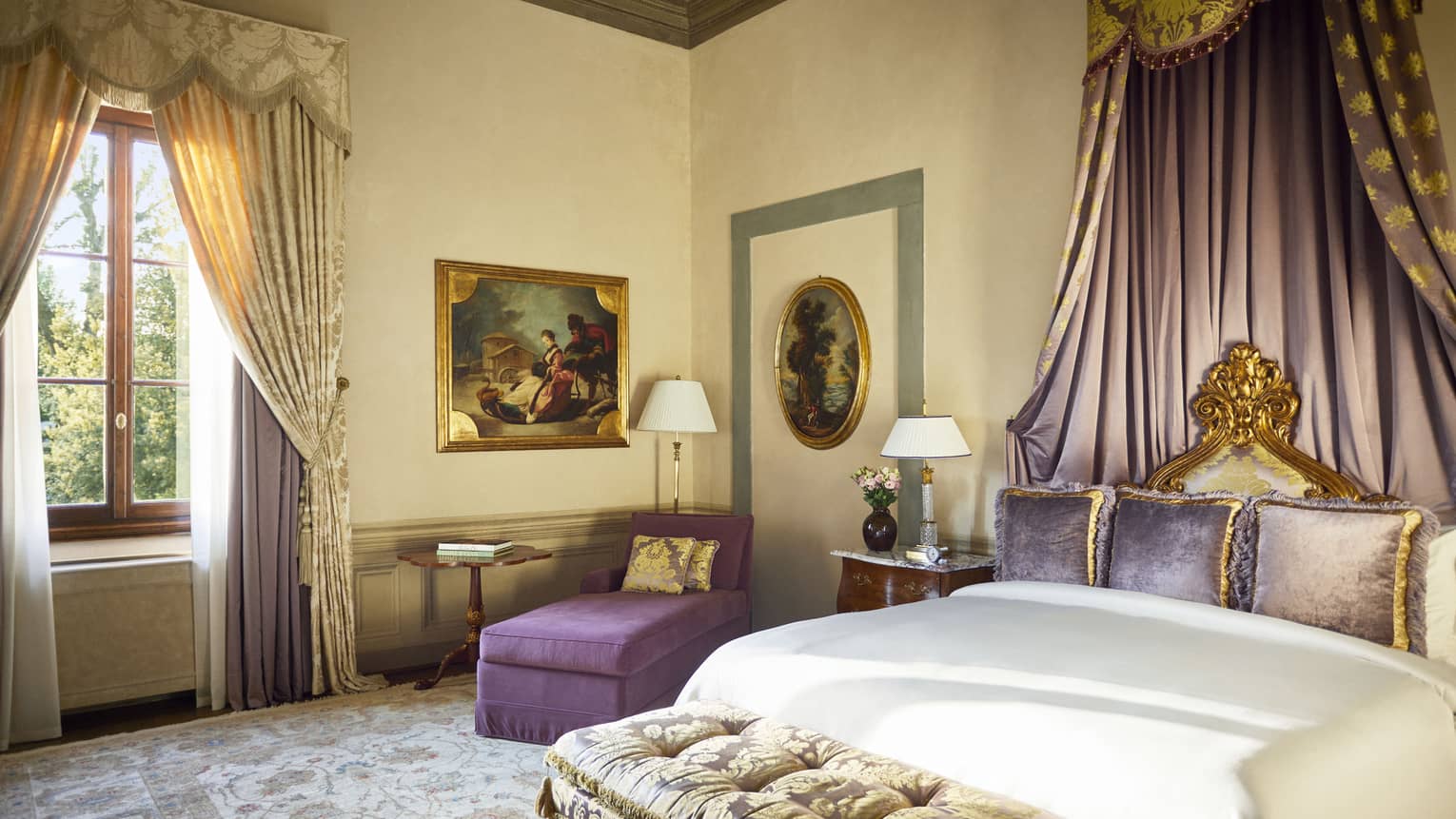 Royal Suite bedroom with king bed, draped canopy detail, plum-coloured chaise and gold window drapes, at Four Seasons Hotel Florence, Italy