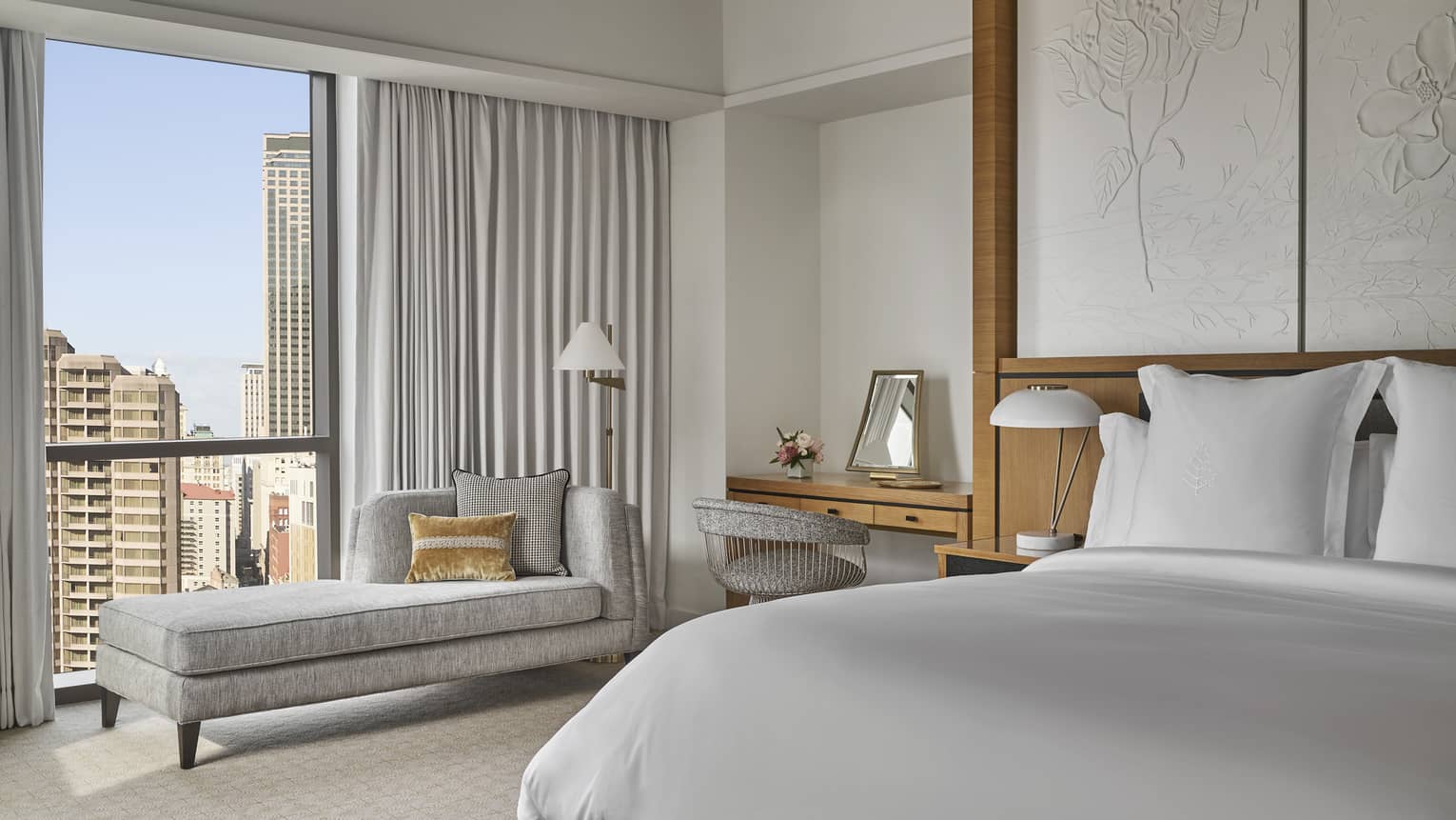 Bedroom with king bed and window-side chaise lounge
