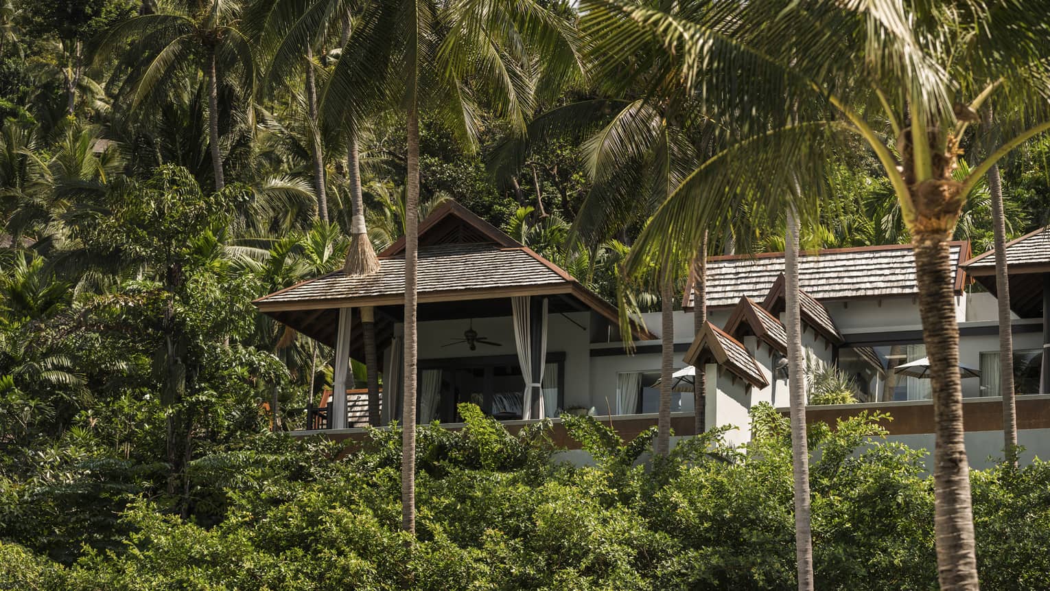 Exterior of a private villa nestled in the trees