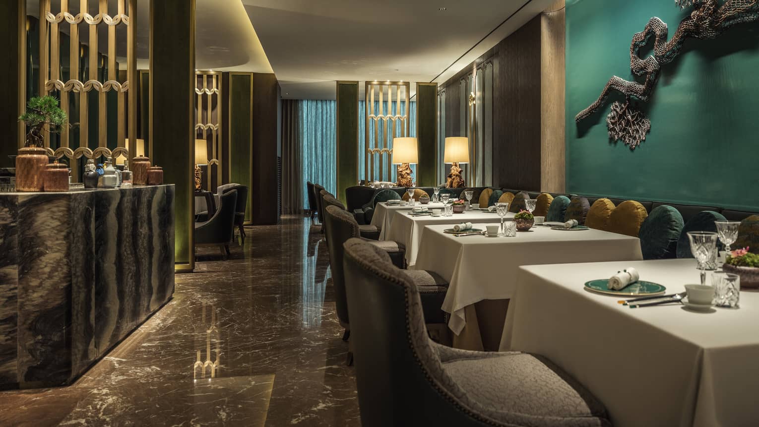 Yu Yuan dining tables, chairs, modern buffet, green walls with modern wire sculpture