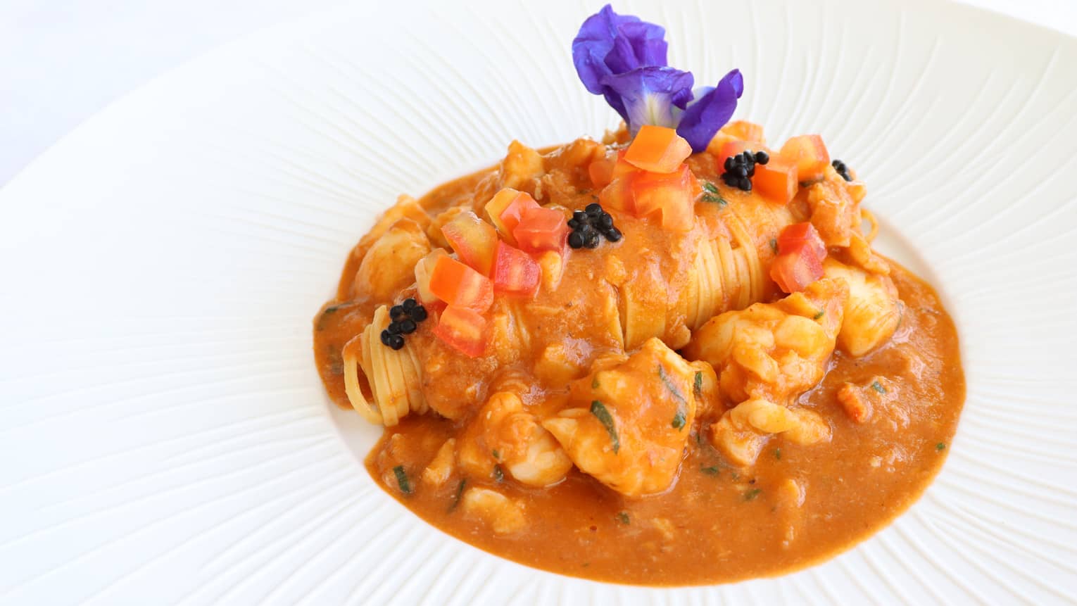 Tagliolini with Lobster, Vanilla Bisque, Tomato and Herring Caviar