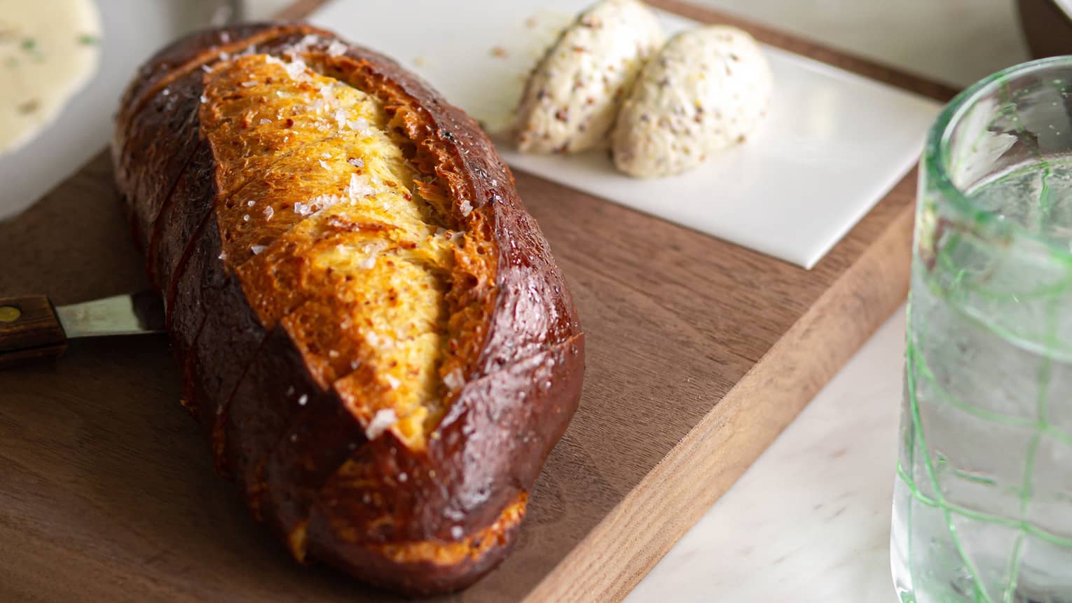 Chef Patrick?s house-made pretzel bread served on a wooden tray with two dollops of stone-ground mustard on the side