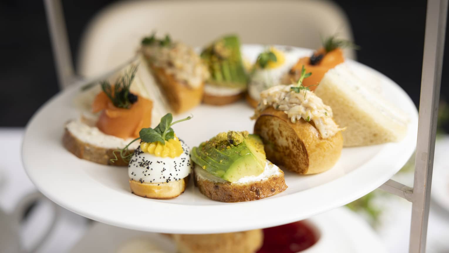 A plate full of various colorful hors d'oeuvres