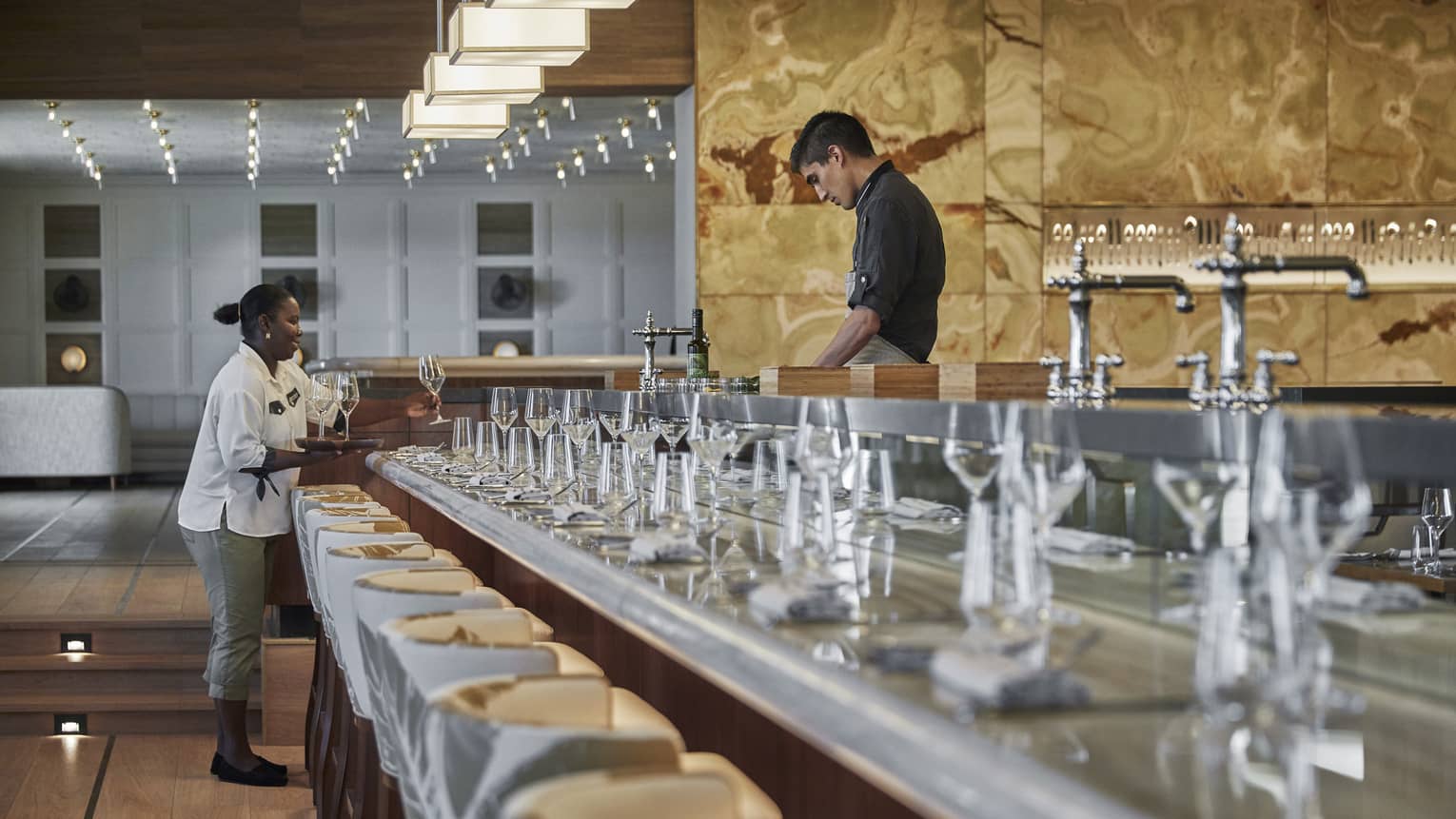 Two team members working in a dining outlet.