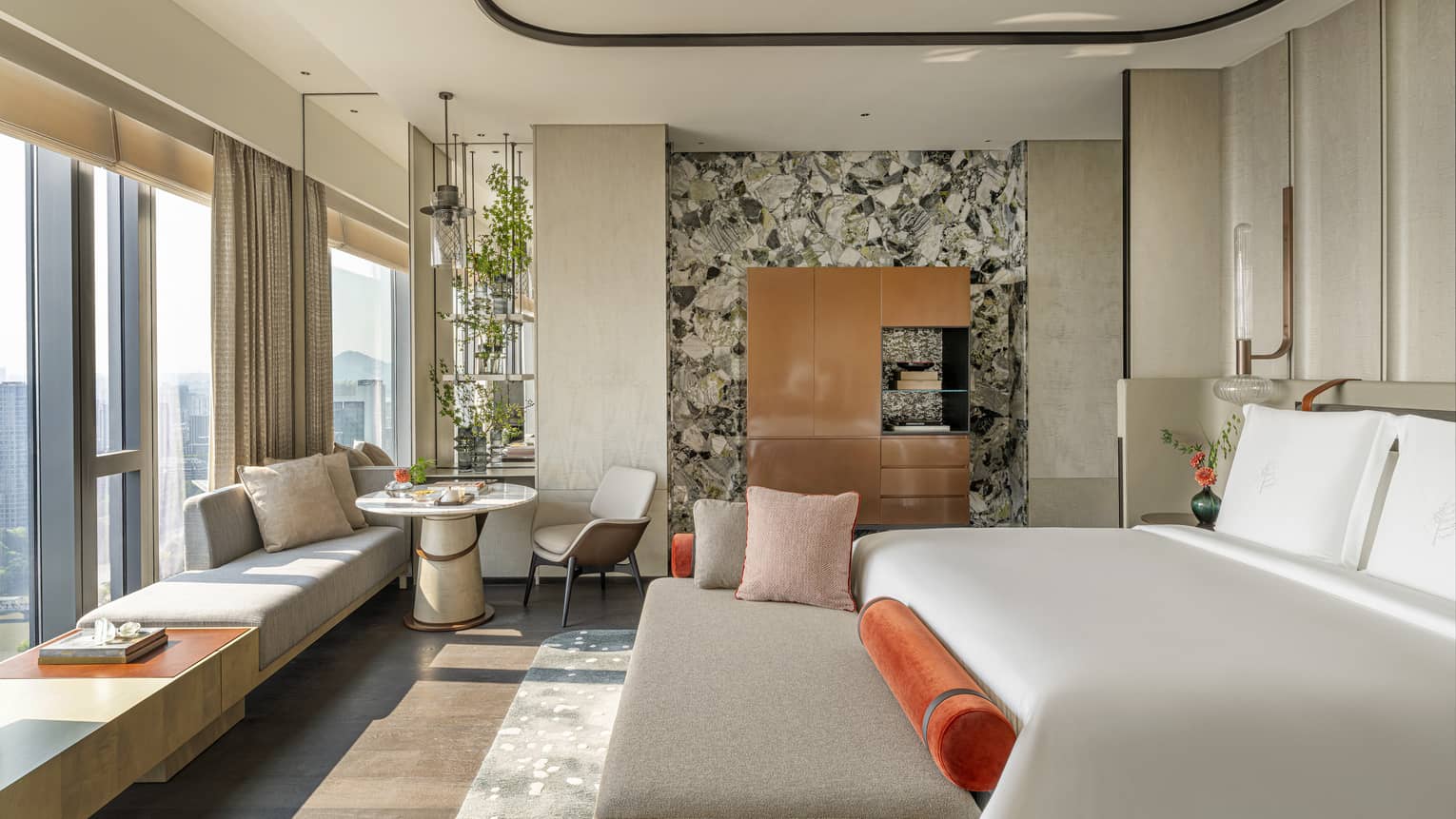 Penthouse Suite bedroom with king bed and windowside chaise at Four Seasons Hotel Hangzhou at Hangzhou Centre