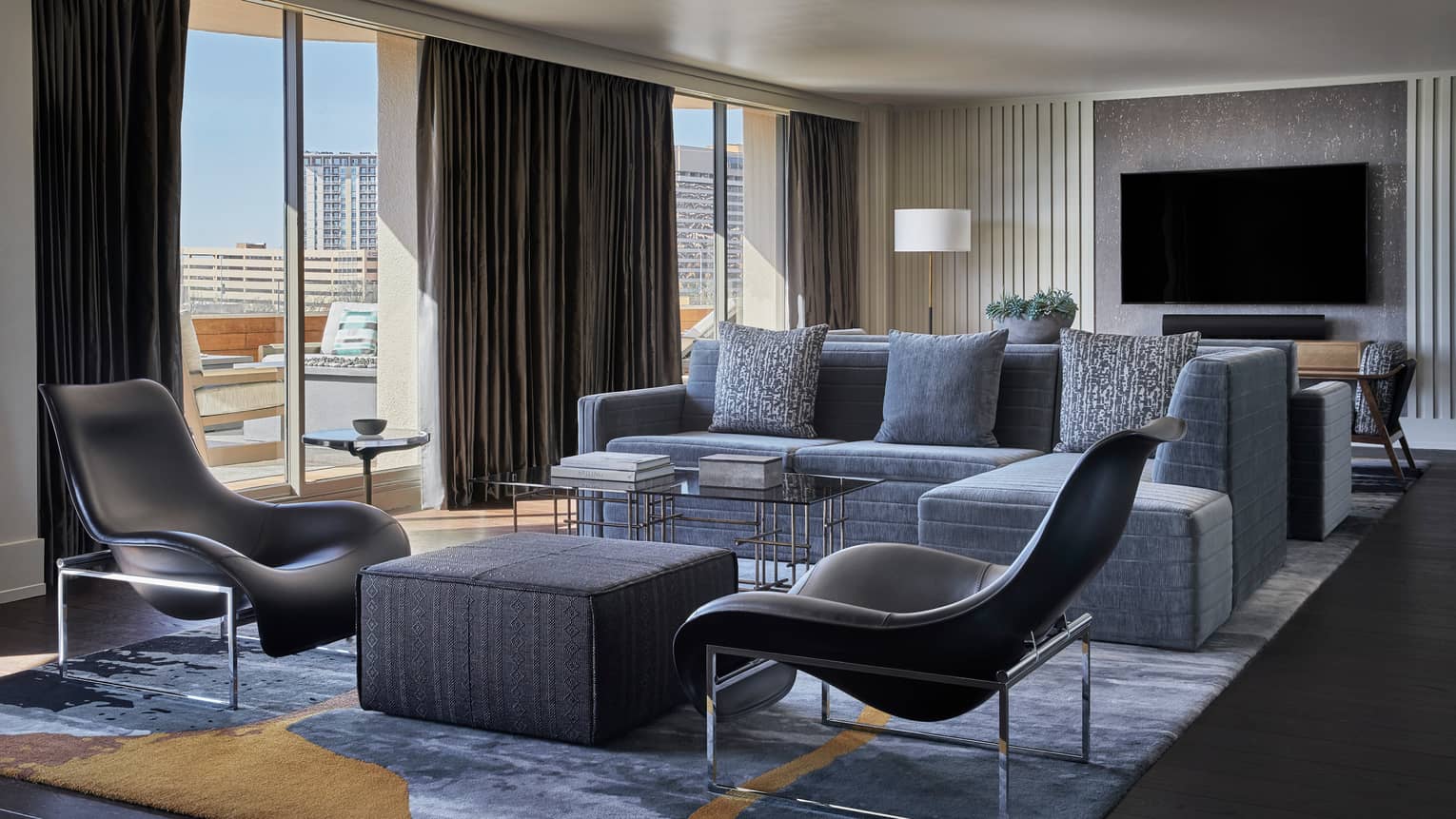 Congressional Suite modern sectional sofa, accent chairs, floor-to-ceiling windows, TV