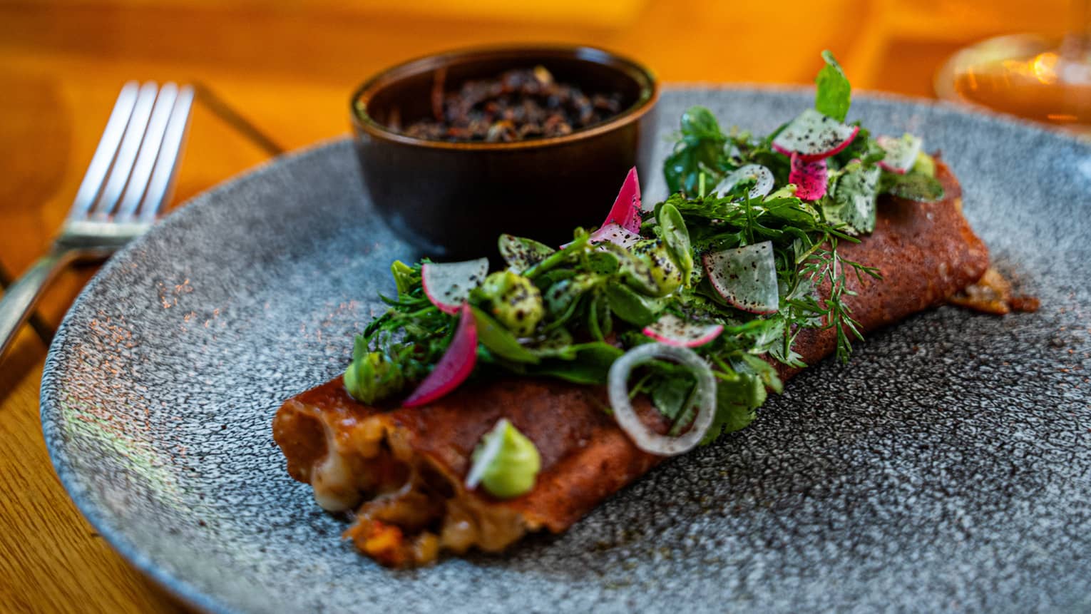 Ribeye Costra - Spiced ribeye with garlic, cinnamon and paprika. Manchego and panela cheese, mixed greens and blackened red sauce
