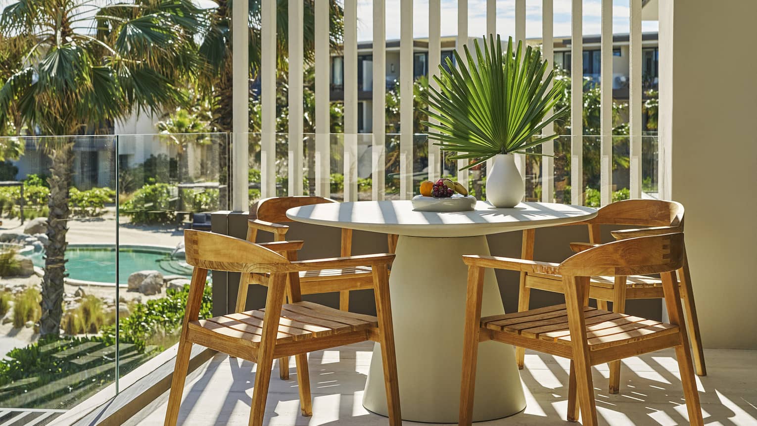 Round dining table on a private terrace of luxury resort room at Four Seasons Resort Los Cabos