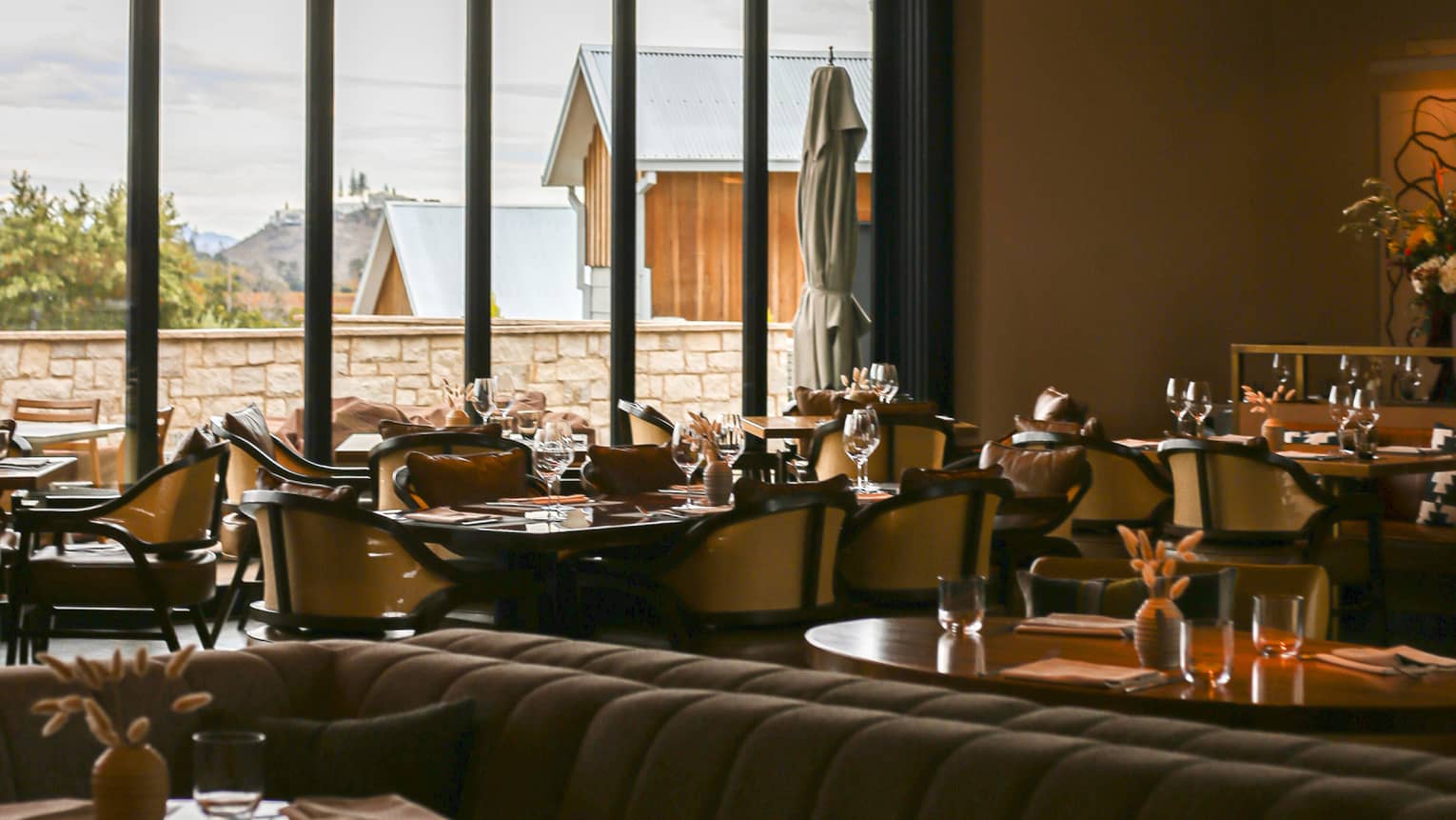 Dining room at TRUSS Restaurant + Bar with large, rectangular windows.