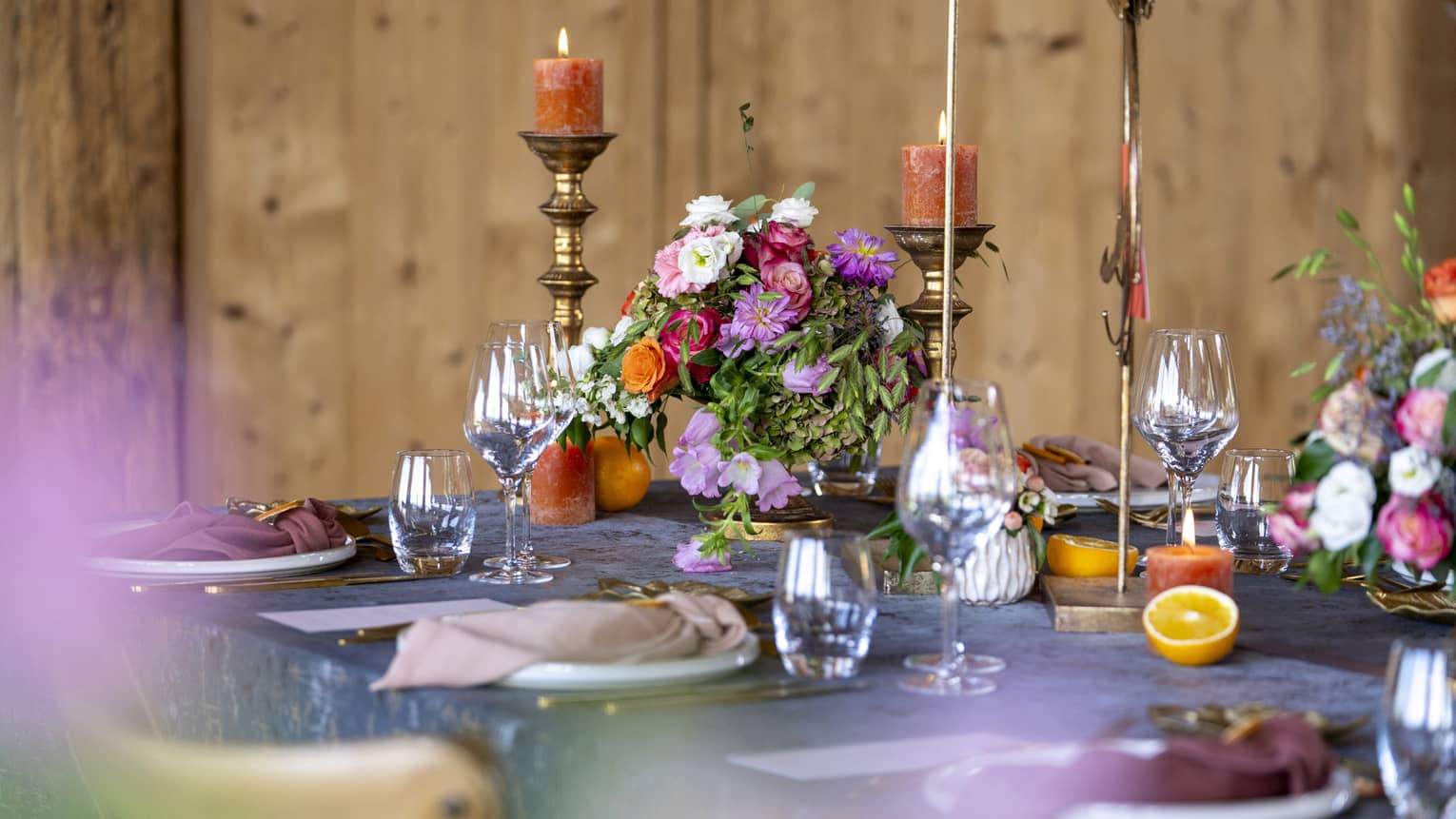 Wedding table setting with assorted flowers and burnished accents