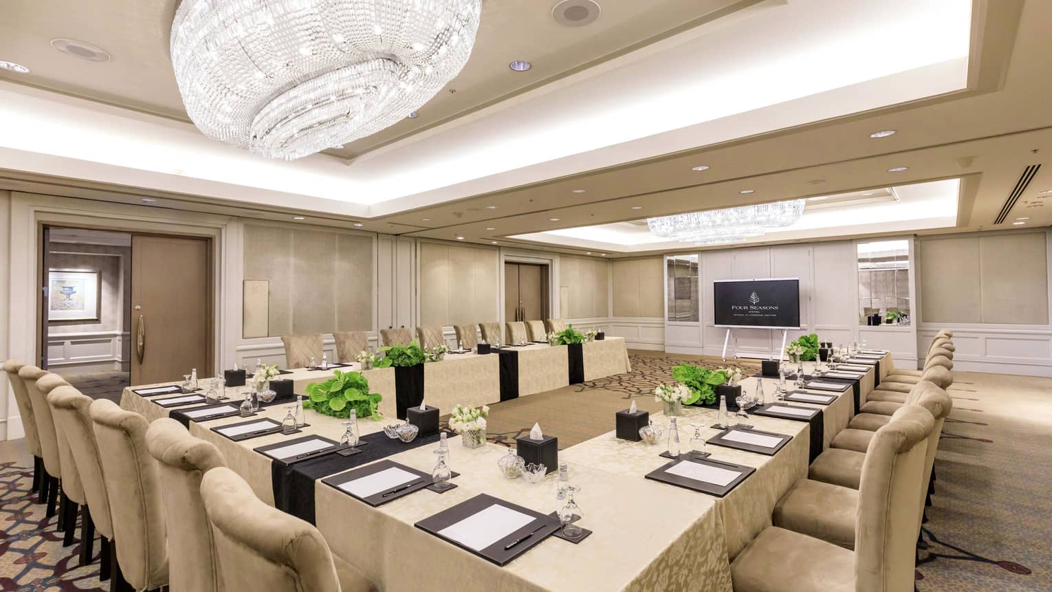 Elegant meeting room with u-shape set up and crystal chandelier