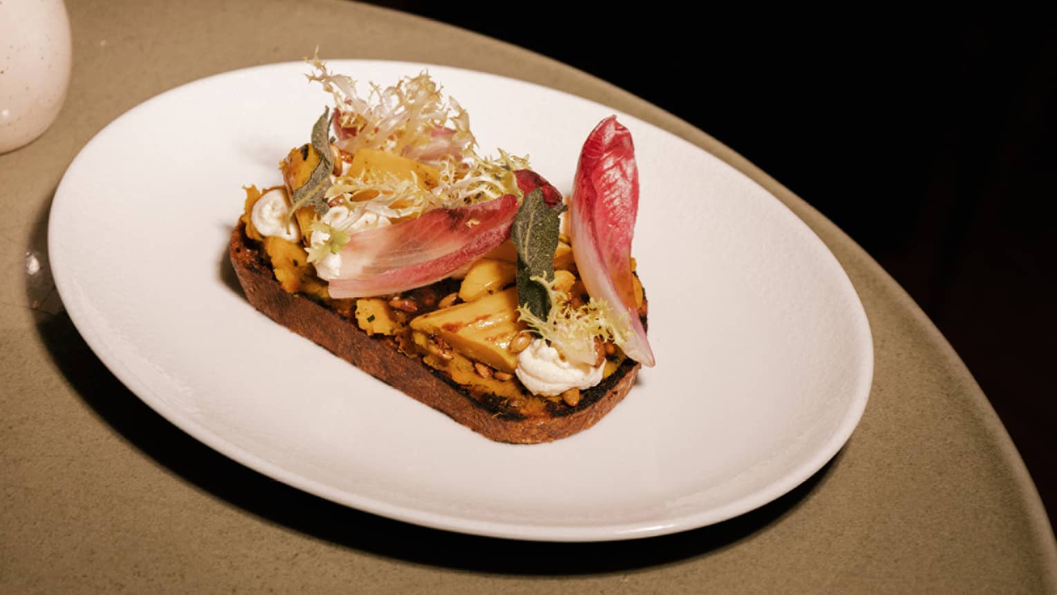 Roasted squash tartine with delicata and butternut squash, whipped ricotta, candied pumpkin seeds and black truffle honey