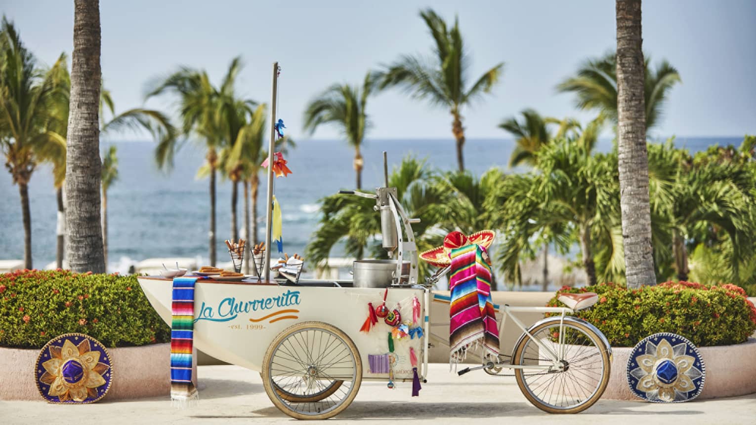 A playful "Churro Cart" set along the beach