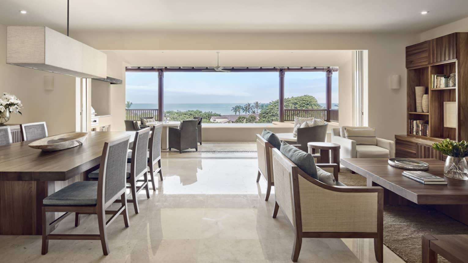 Living room and dining area with ocean view