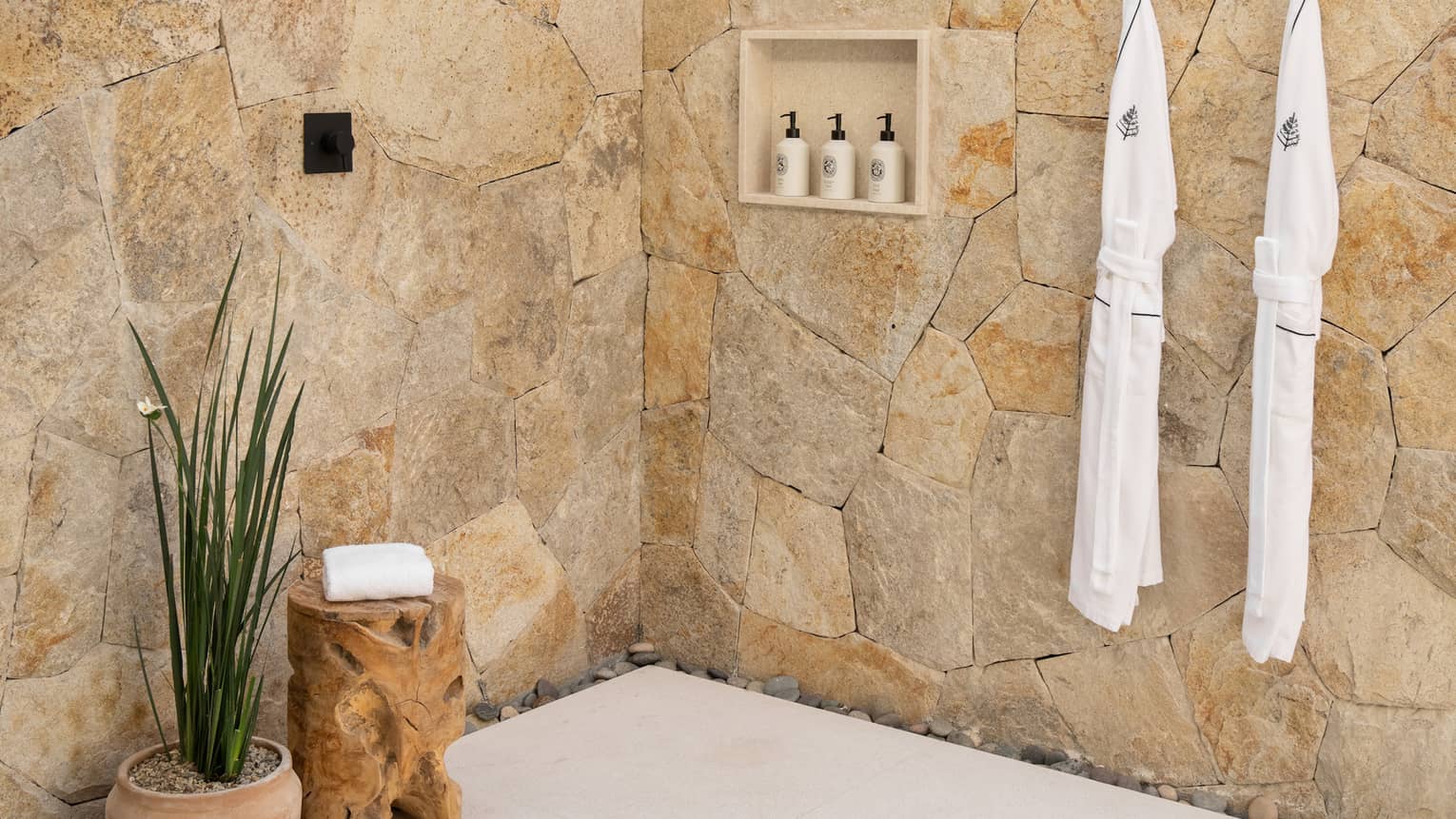 Outdoor stone shower with pergola top