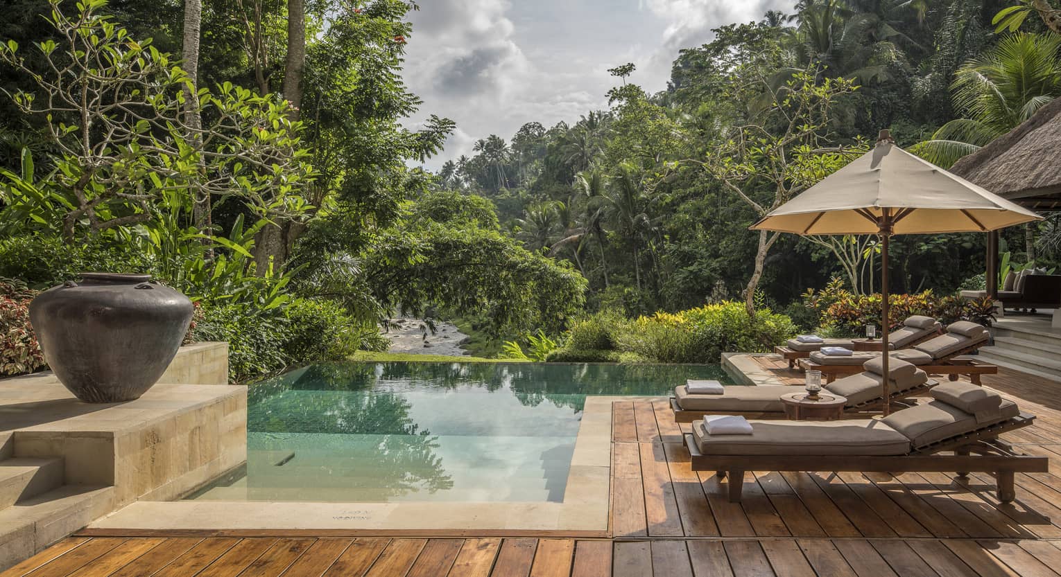 A relaxing villa with an infinity pool overlooking a river in Bali