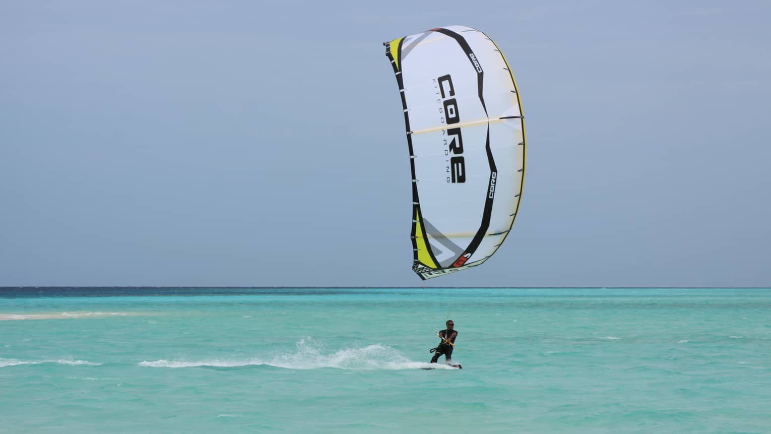 Windsurfer on blue ocean