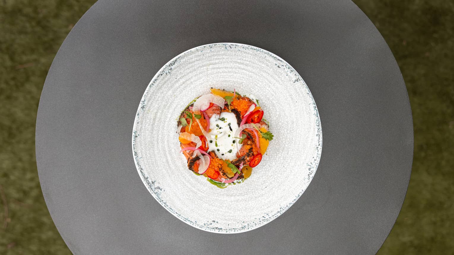 Dish with tomatoes and cheese on a plate.