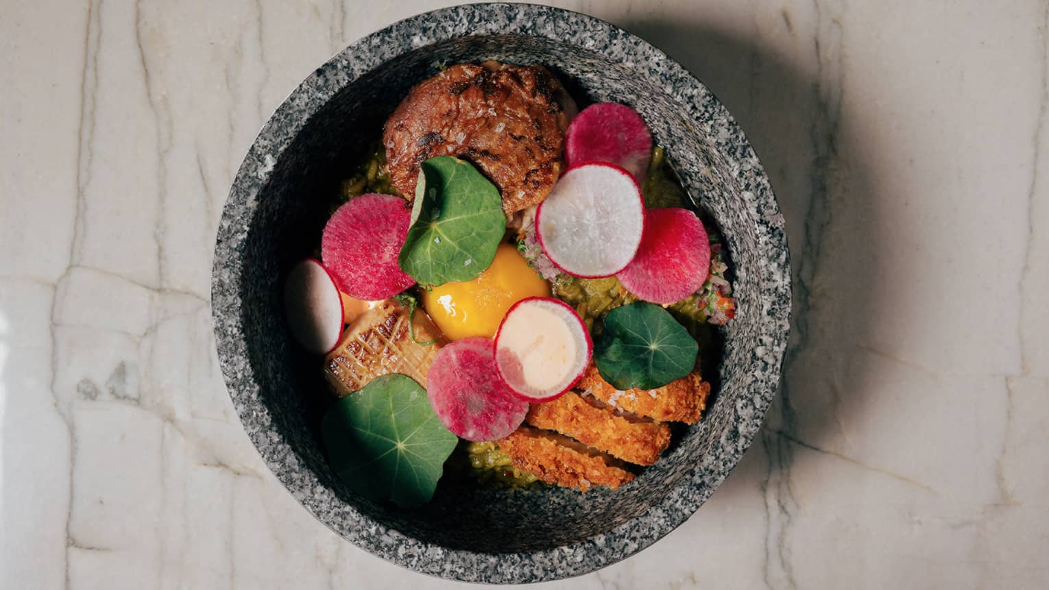 Colorful and savoury meal on marble background