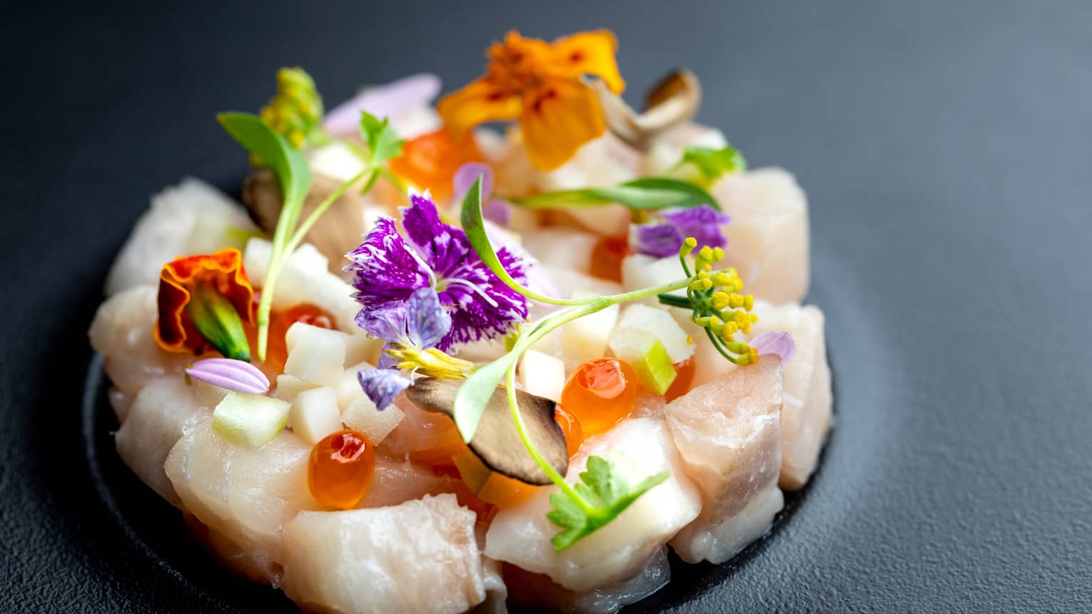 The Blvd close-up of ceviche garnished with edible flowers 